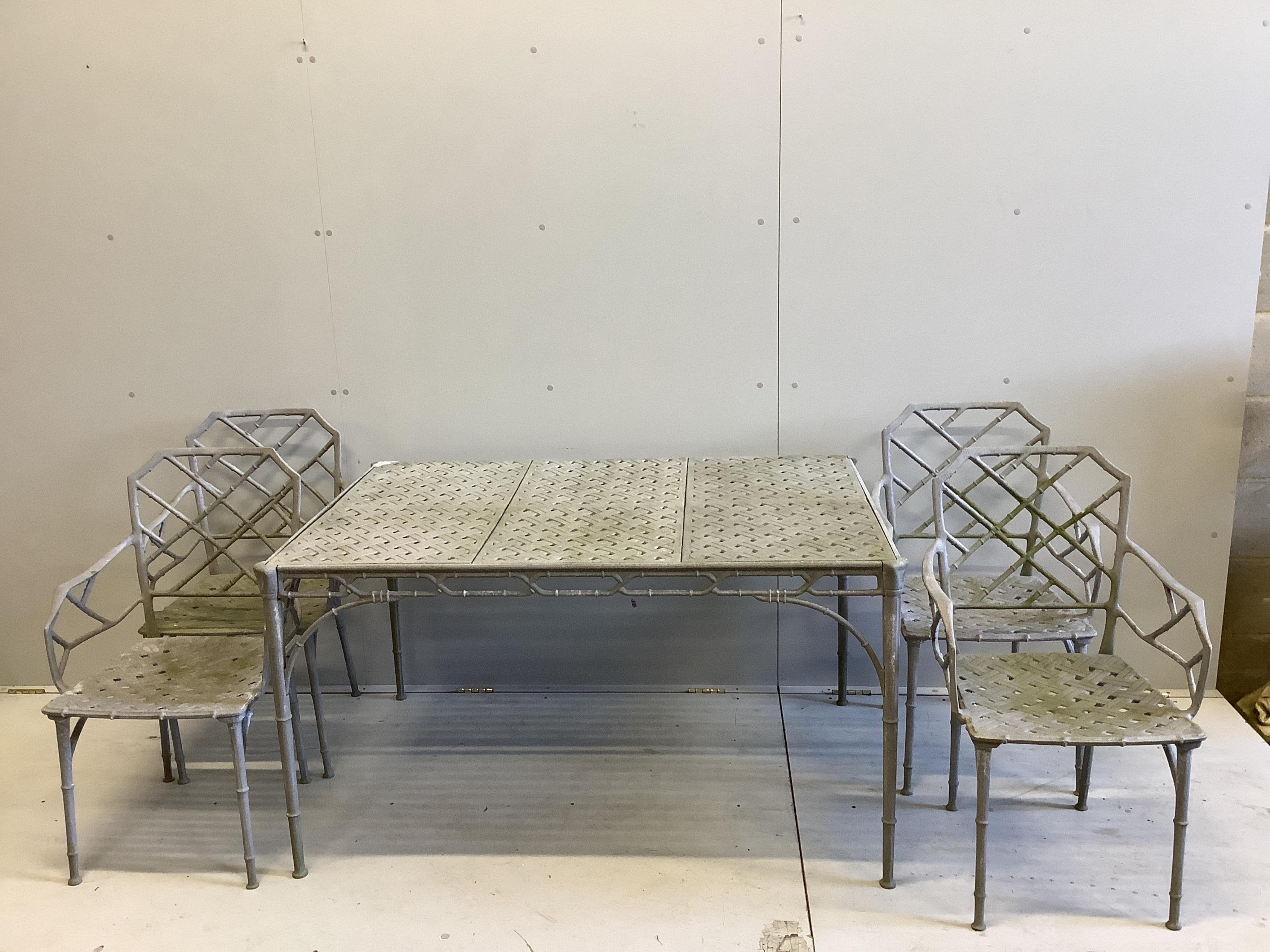 A set of four Chinese style white painted cast aluminium and simulated bamboo lattice back chairs and similar table, width 130cm, depth 88cm, height 71cm. Condition - fair